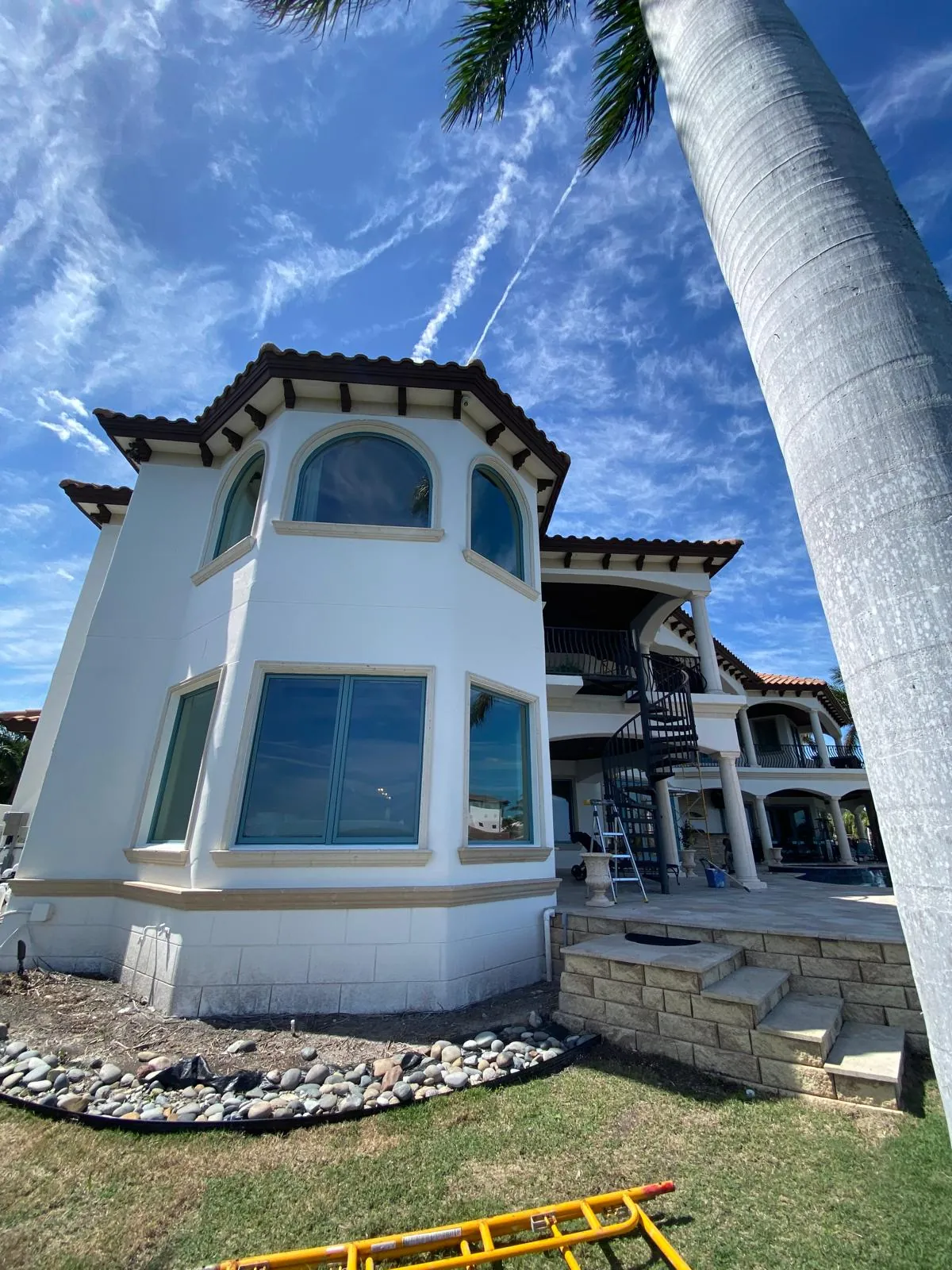Waterfront stucco home exterior painting in Tampa Bay