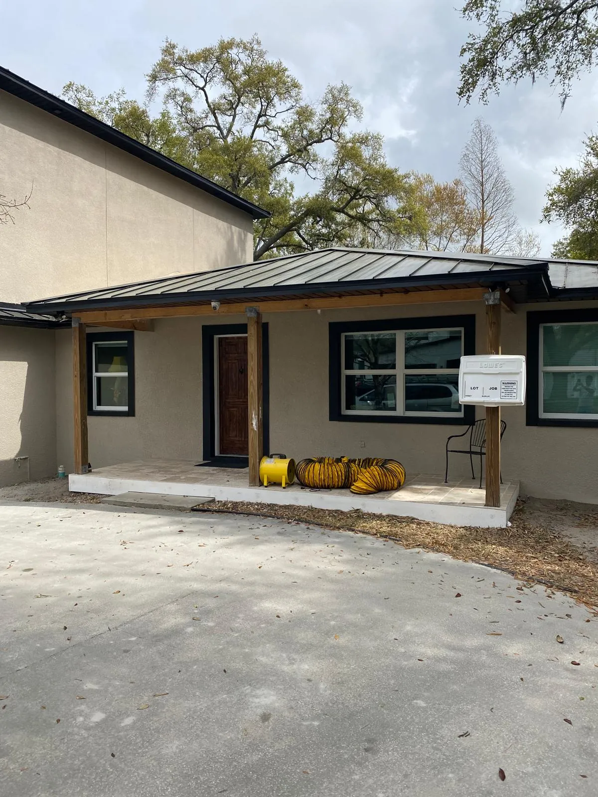 Brown stucco home exterior freshly painted