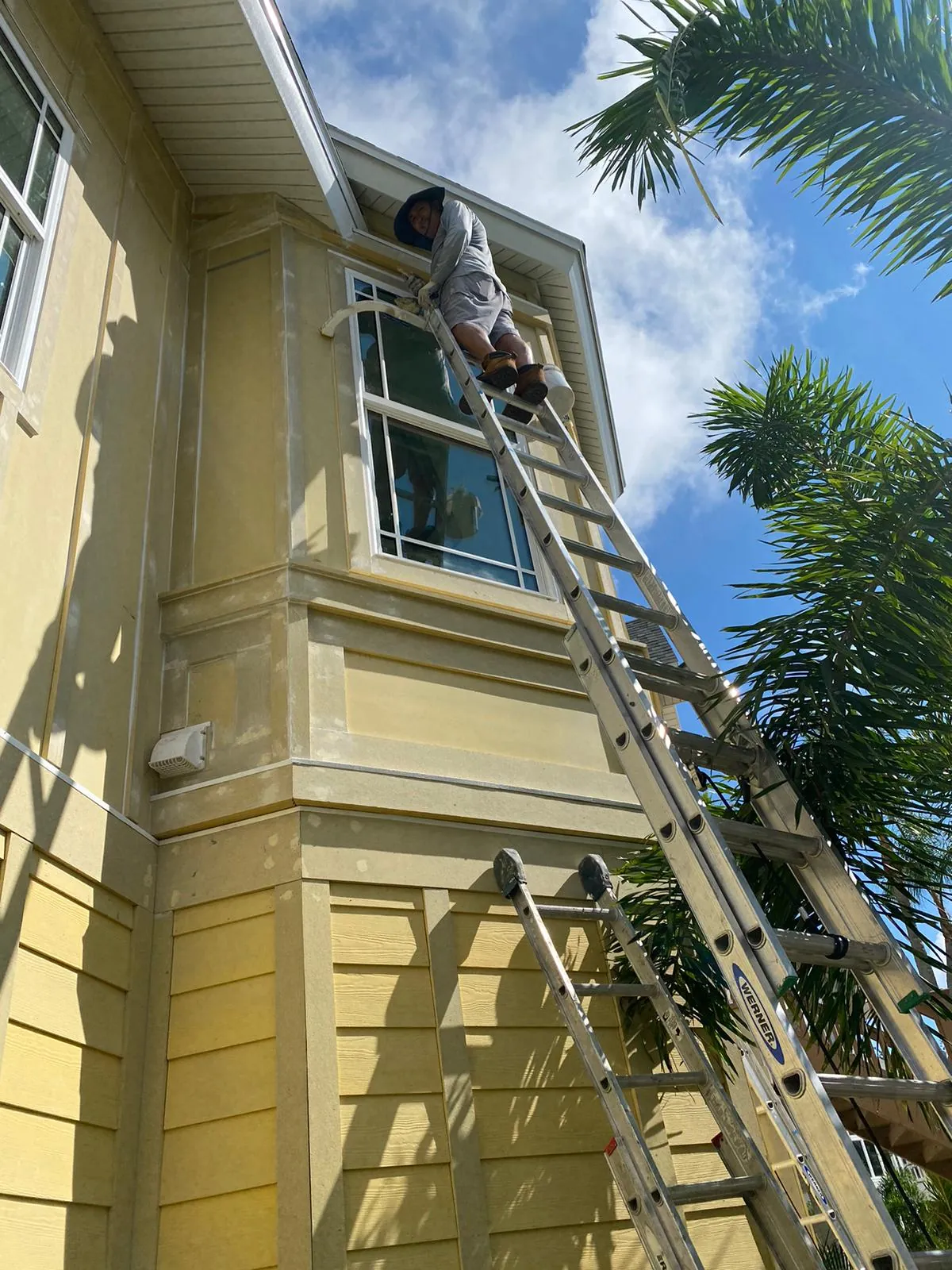 Gray craftsman-style home exterior repaint