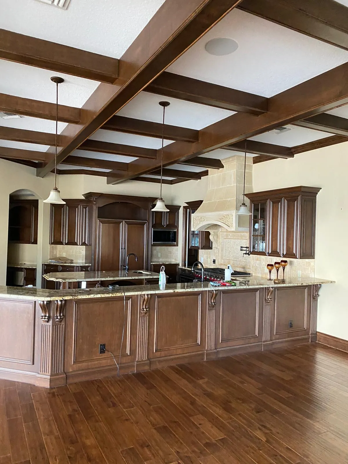 Wood beam staining above kitchen area