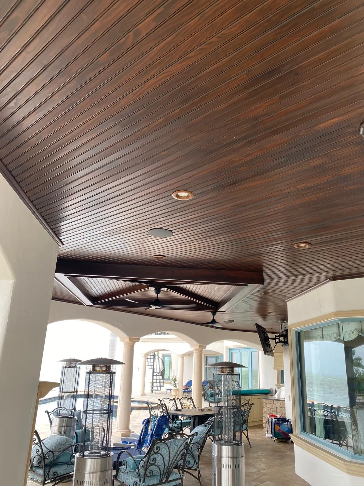 Rich dark wood ceiling staining with exposed beams